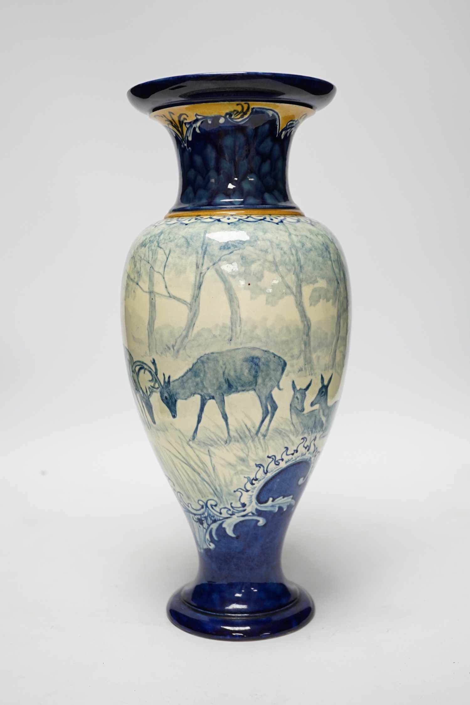 A Doulton Lambeth faience vase, c.1900, attributed to Hannah Barlow, painted with deer in woodland, monogram to the body, and to the base ‘KBS’ for Katherine B. Smallfield, 35cm, high, cf. Bonhams, Knightsbridge, London,